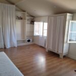 Bright and spacious 20 m² student bedroom with desk, storage and natural light in a host family home in Bordeaux.