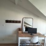 Large study desk and dedicated workspace in a bright student bedroom at a welcoming host family home in Bordeaux.