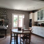 Bright and spacious living room in a welcoming Bordeaux host family home with comfortable seating and a warm family atmosphere.