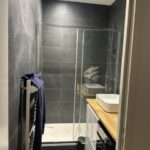 Modern bathroom with walk-in shower in Bordeaux homestay